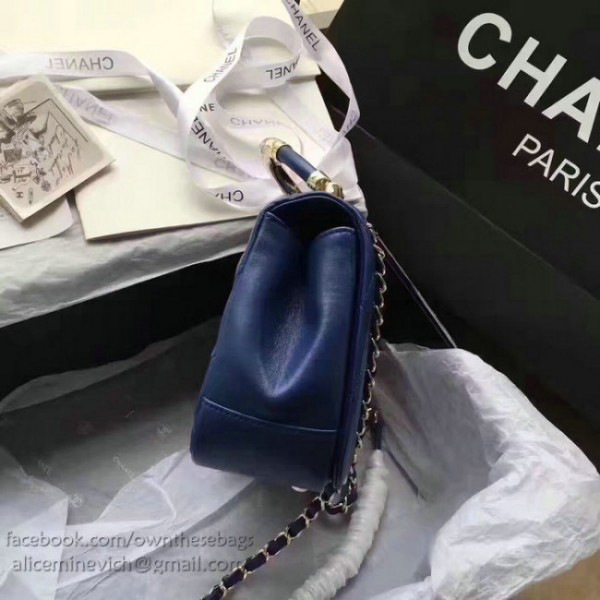 Ch**el caviar quilted lambskin flap bag with top handle blue