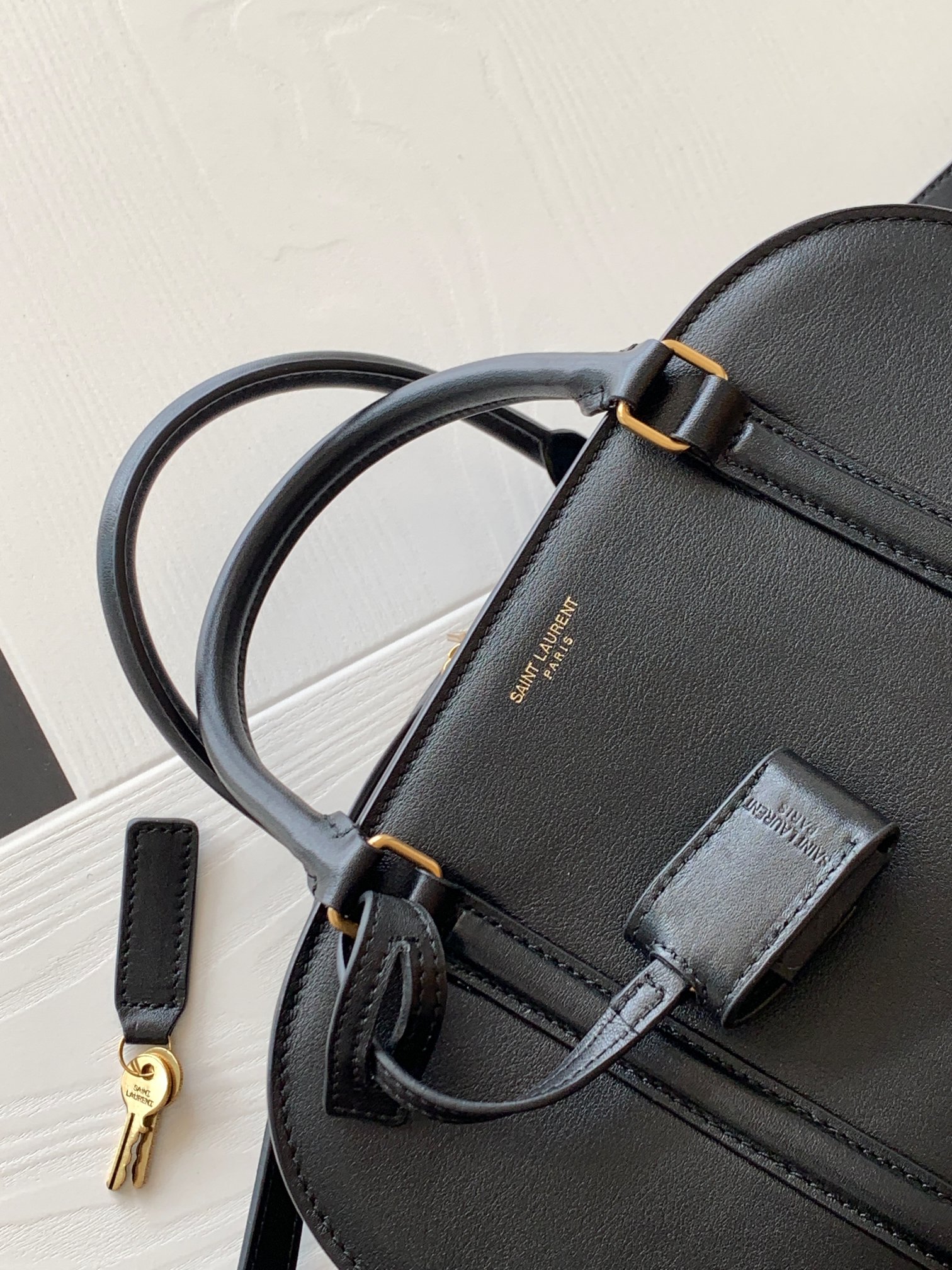 Y51 lock baby duffle in smooth leather 65500816r0w1000 27×18×12cm