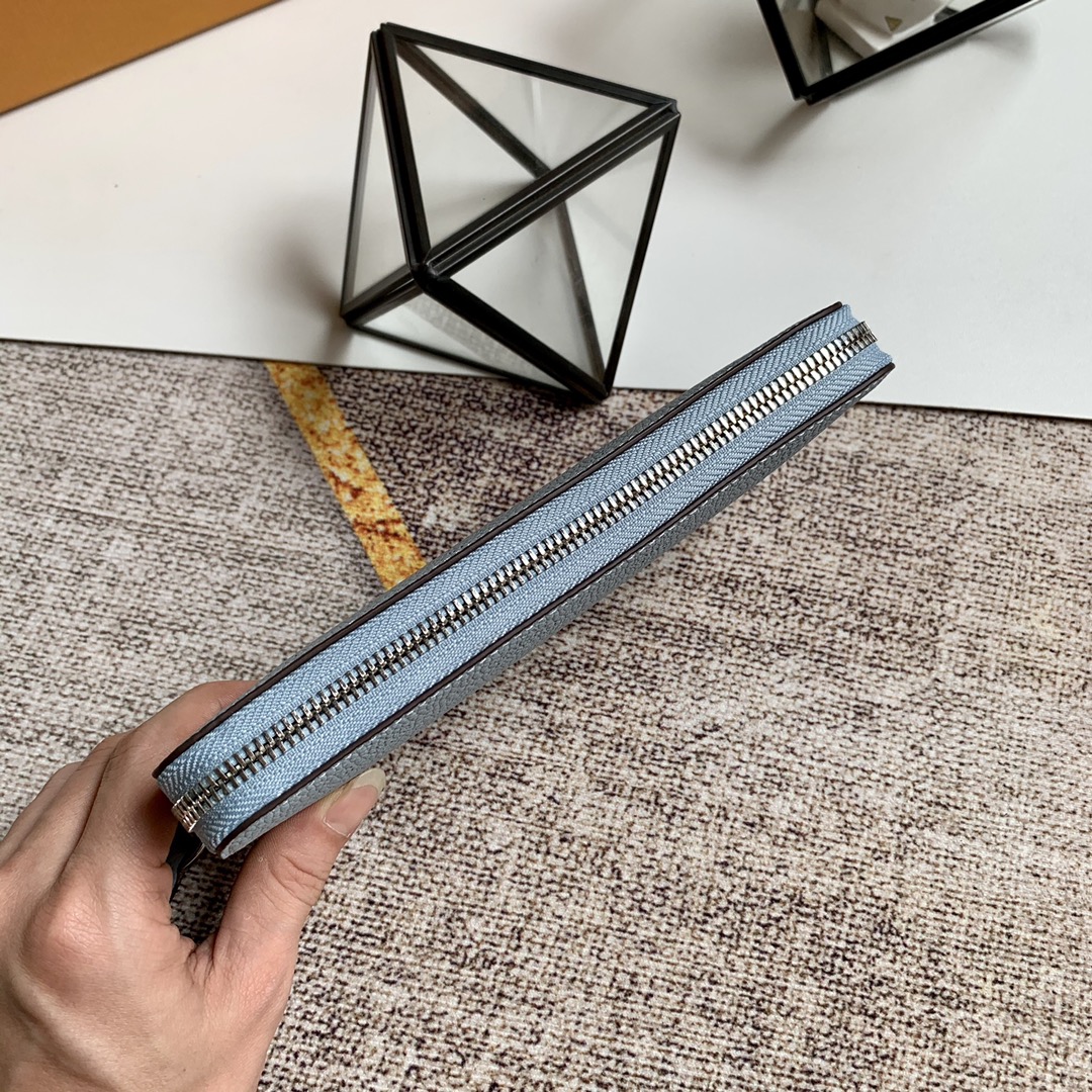 l0vis Vvtt0n zippy wallet monogram perforations mahina leather blue m61867 19 x 10 cm