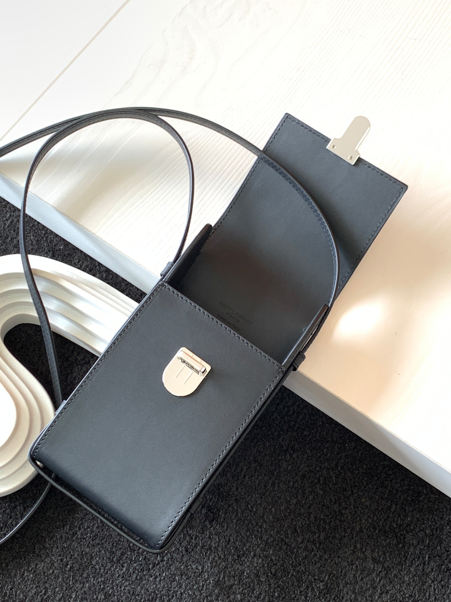 y51 tuc phone pouch with strap in S*pple calfskin black 6677182 9 x 3.5 x 18 cm